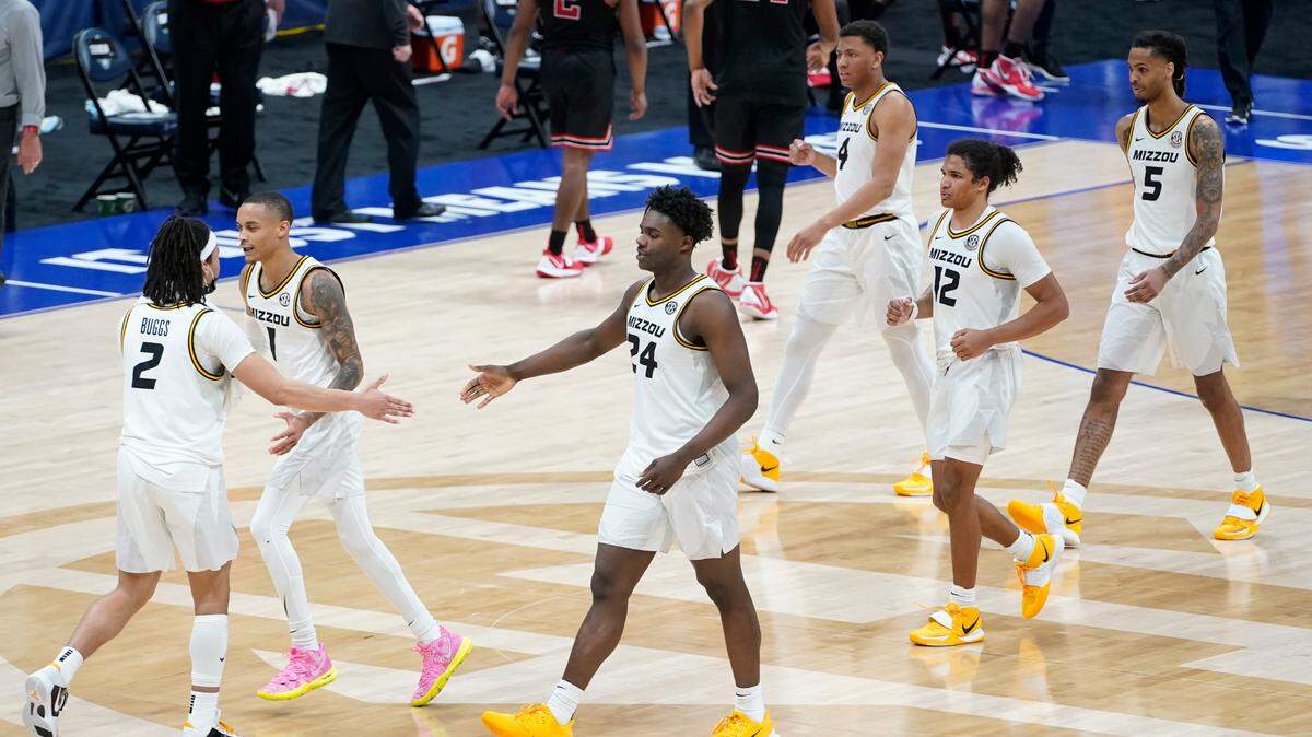 Missouri players leave the court after beating Georgia in an NCAA college basketball game in the Southeastern Conference Tournament Thursday, March 11, 2021, in Nashville, Tenn. (AP Photo/Mark Humphrey)