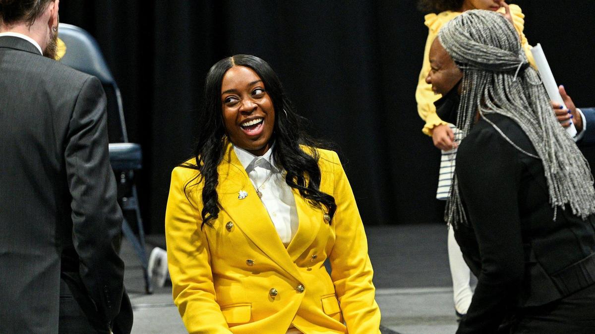 Dionnah Jackson-Durrett chats with family members after the event introducing her as the University of Missouri-Kansas City’s new women’s basketball head coach at an event at the Swinney Center Tuesday, April 12, 2022.