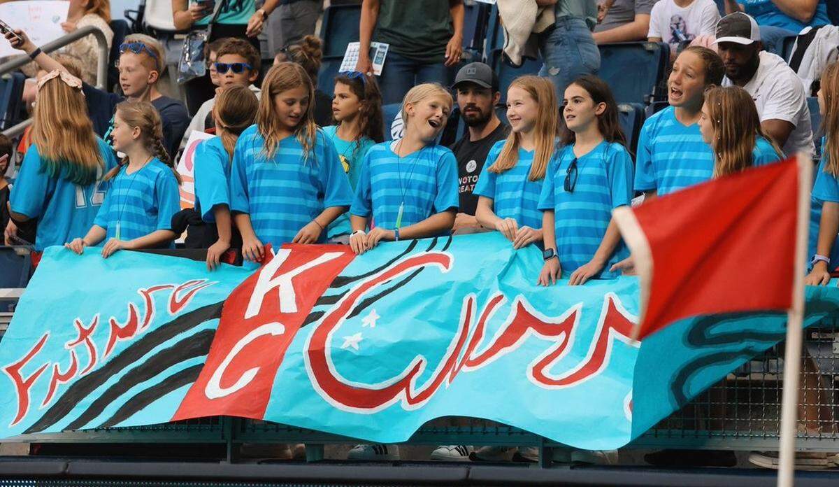 Members of the Olathe Stars girls U-12 soccer team cheer on the Kansas City Current, who tied Angel City FC 1-1 and set a new attendance record on Friday night at Children’s Mercy Park in Kansas City, Kan.