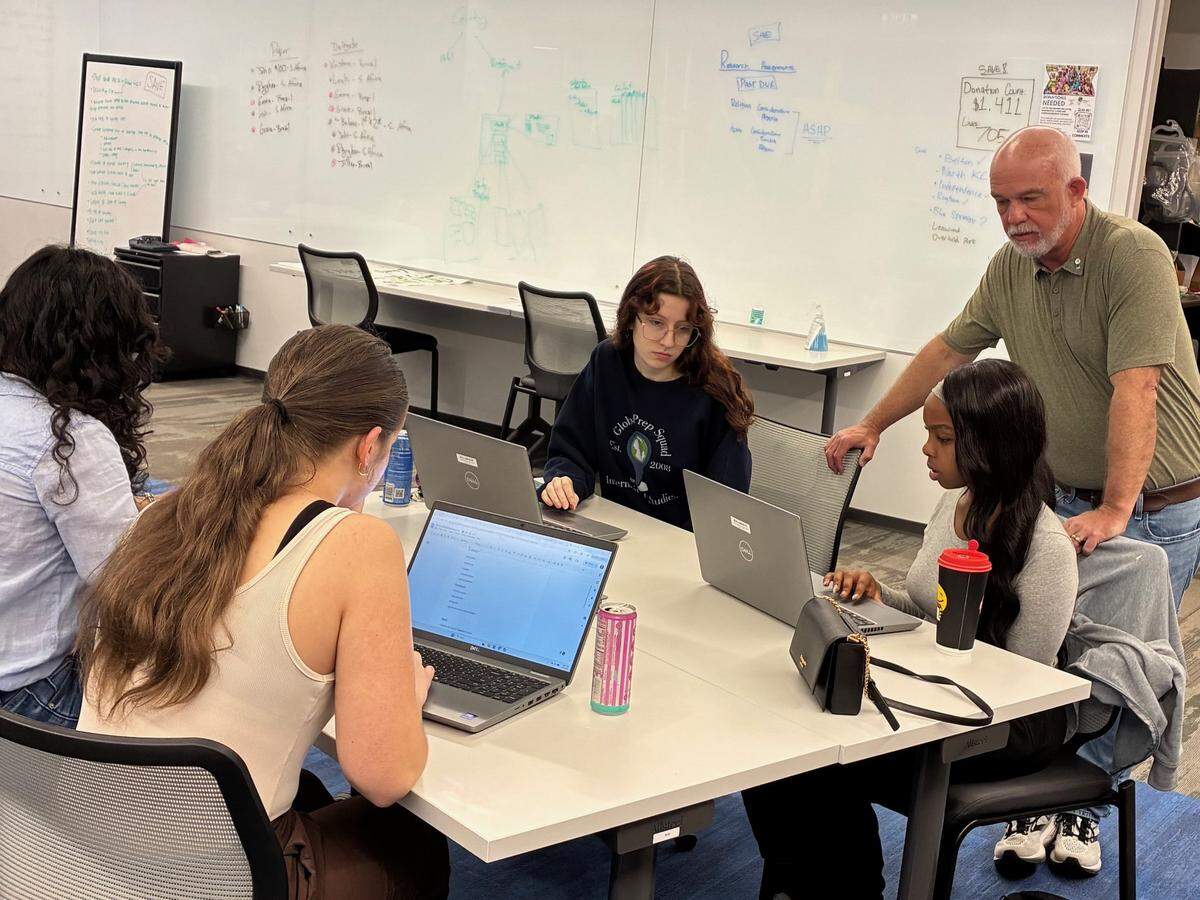 Instructor Curtis Cook discusses the apps’ development and marketing with students in the Lee’s Summit R-7 School District’s International Studies Academy.