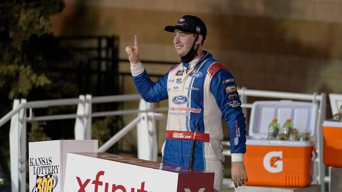 Chase Briscoe celebrates in victory lane following a NASCAR Xfinity Series auto race at Kansas Speedway in Kansas City, Kan., Saturday, Oct. 17, 2020. (AP Photo/Orlin Wagner)