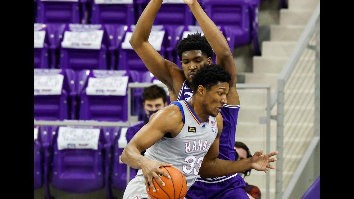 Kansas’ David McCormack dribbles into TCU’s Kevin Samuel during a Big 12 men’s basketball game on Jan. 5, 2021 in Fort Worth, Texas.