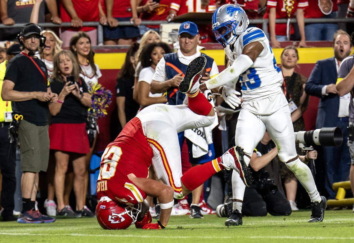 Kansas City Chiefs tight end Travis Kelce (87) gets up-ended by Detroit Lions cornerback Rock Ya-Sin (23)  and lands on his head during the first half of the game at GEHA Field at Arrowhead Stadium on Sunday, October 12, 2025, in Kansas City. 