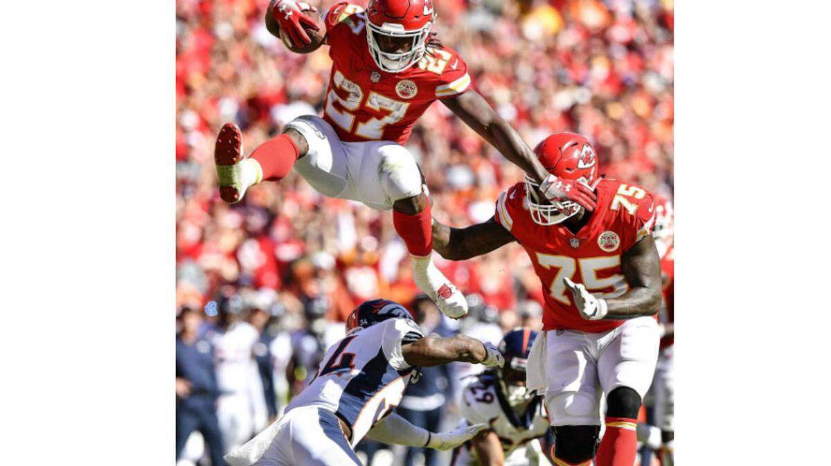 After catching a pass thrown by Kansas City Chiefs quarterback Patrick Mahomes, running back Kareem Hunt made a spectacular leap over Denver Broncos defensive back Will Parks on his way to a the end zone for a touchdown in the third quarter in Kansas City. It was Mahomes’ 26th touchdown pass of the 2018 regular season.