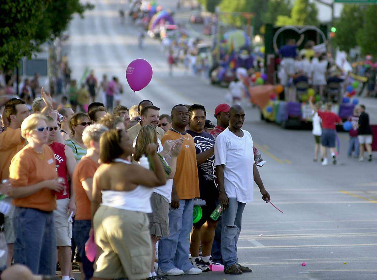 Crowds gathered at the corner of Broadway and Valentine Road in Kansas City to watch the Gay Pride Parade travel from Westport to Penn Valley Community College in 2002.