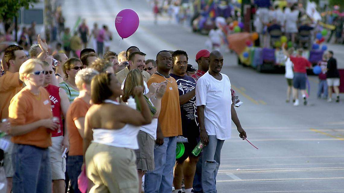 Crowds gathered at the corner of Broadway and Valentine Road in Kansas City to watch the Gay Pride Parade travel from Westport to Penn Valley Community College in 2002.