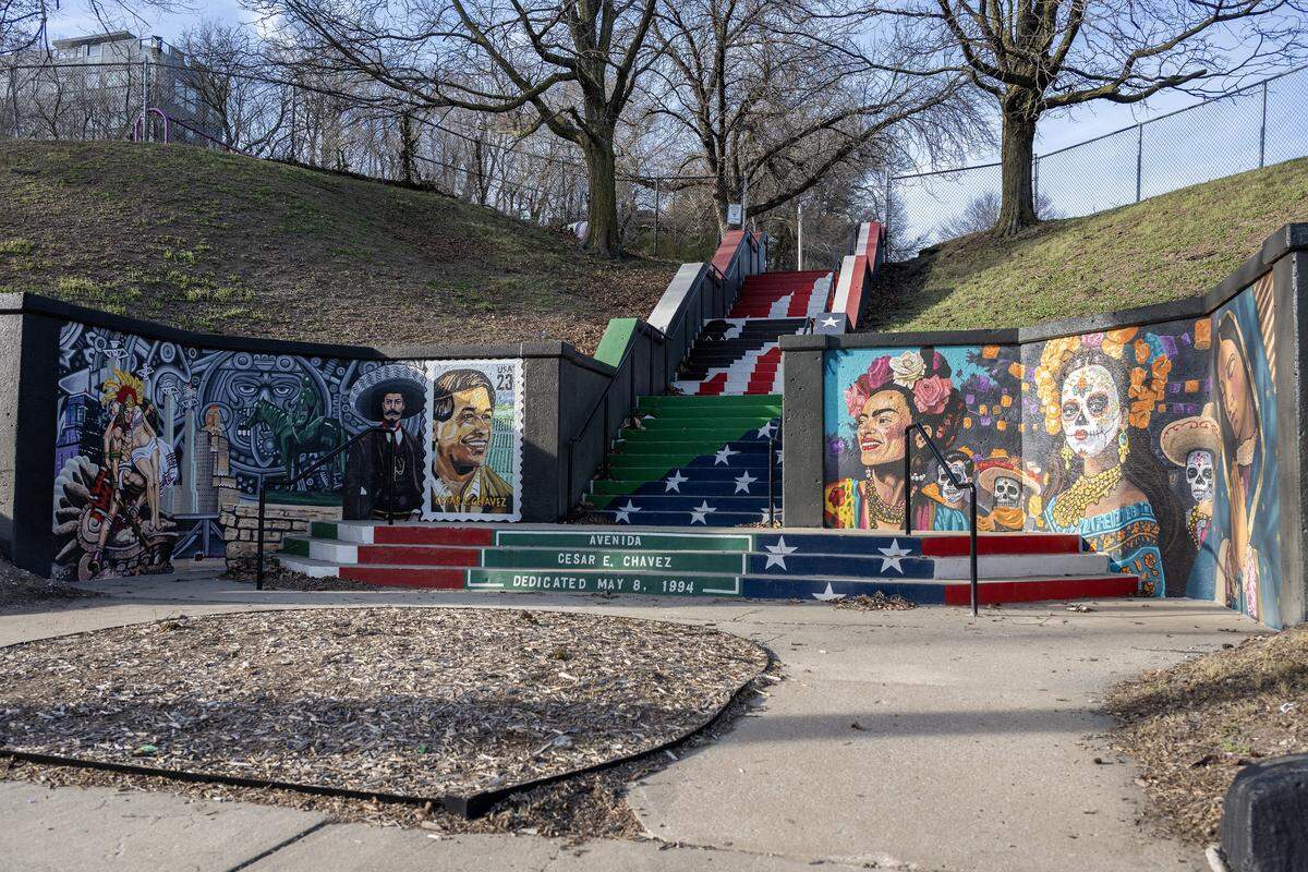 Murals, including a portrait of César E. Chávez, line the concrete steps leading to Gage Park from Avenida Cesar E. Chavez in Kansas City's West Side neighborhood on Thursday, March 19, 2026.
