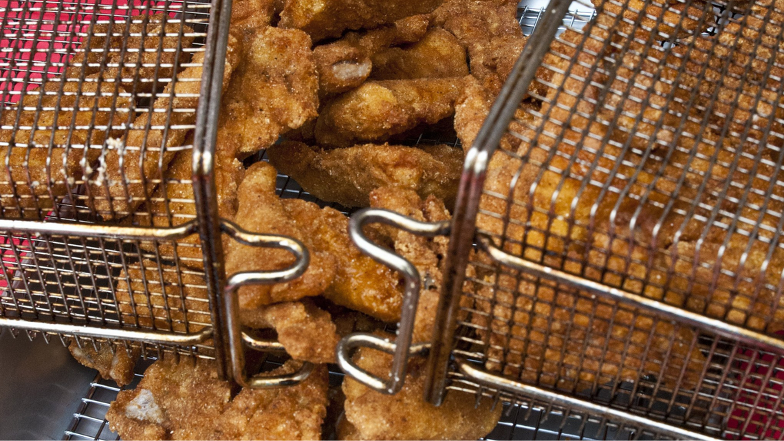 Fish is prepared to serve at a Lent event in 2014.