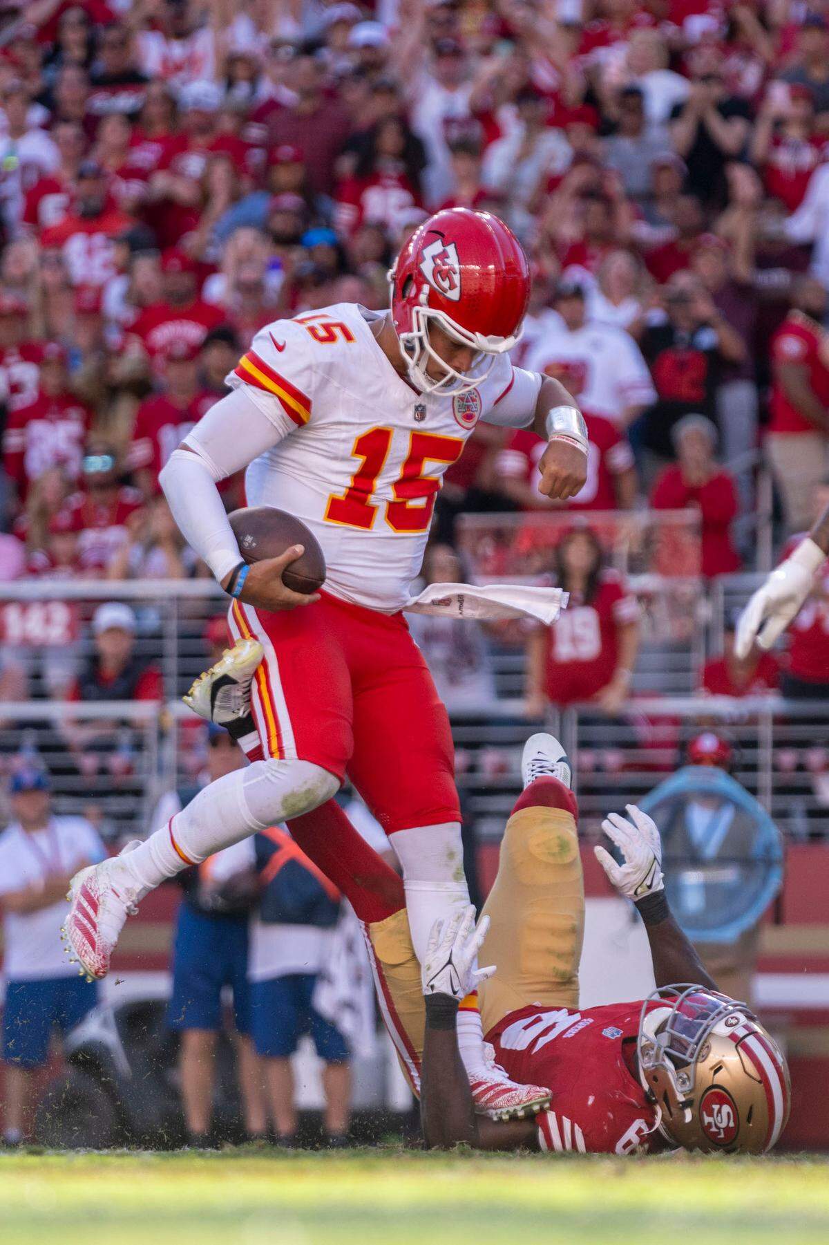 Kansas City Chiefs quarterback Patrick Mahomes (15) scores a touchdown against San Francisco 49ers safety Malik Mustapha (6) during the fourth quarter at Levi’s Stadium.