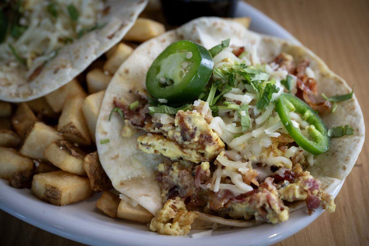 Breakfast Tacos with two flour tortillas with scrambled eggs, pepper jack cheese and bacon, ham, or grilled chicken or turkey, $13.99 at AR's Breakfast and Brunch, 8021 Metcalf Ave., in Overland Park.