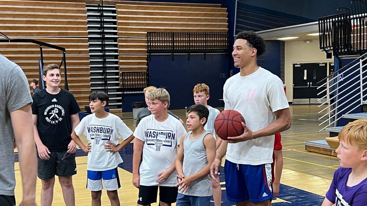 KU super senior Kevin McCullar works with youths at Brett Ballard’s Washburn basketball camp in Topeka.