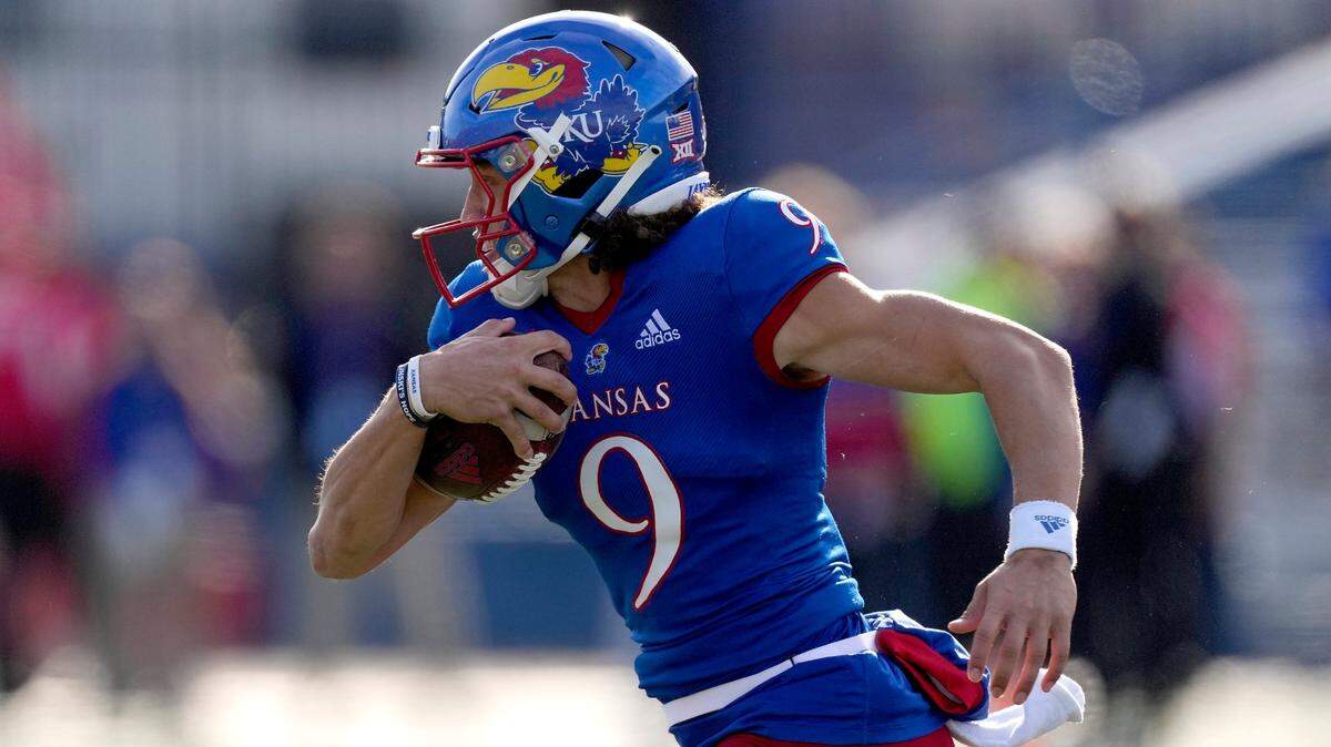 Kansas quarterback Jason Bean runs for a touchdown during the first half against Oklahoma State on Saturday, Nov. 5, 2022, in Lawrence.