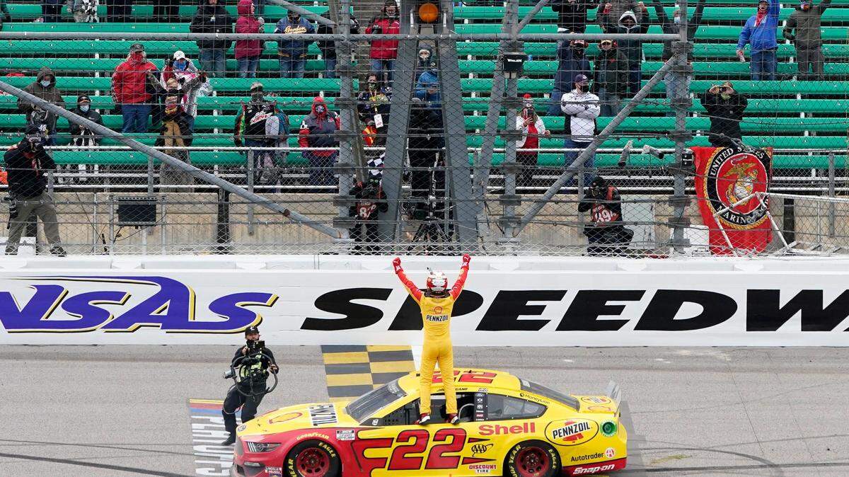 Joey Logano celebrates after winning Sunday’s Hollywood Casino 400 NASCAR Cup playoff race at Kansas Speedway in Kansas City, Kan.