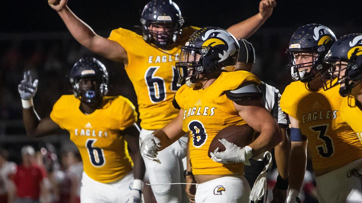 Liberty North running back Cayden Arzola (with ball) celebrates with teammates after scoring a touchdown during the game between the Liberty North Eagles and the Park Hill Trojans on Friday October 1, 2021 in Liberty