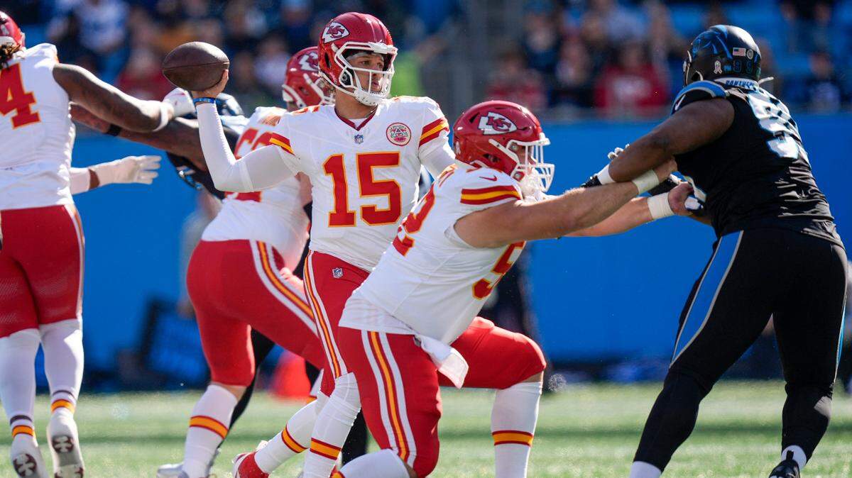 Kansas City Chiefs quarterback Patrick Mahomes (15) throws a touchdown against the Carolina Panthers during the first quarter at Bank of America Stadium on Nov 24, 2024.