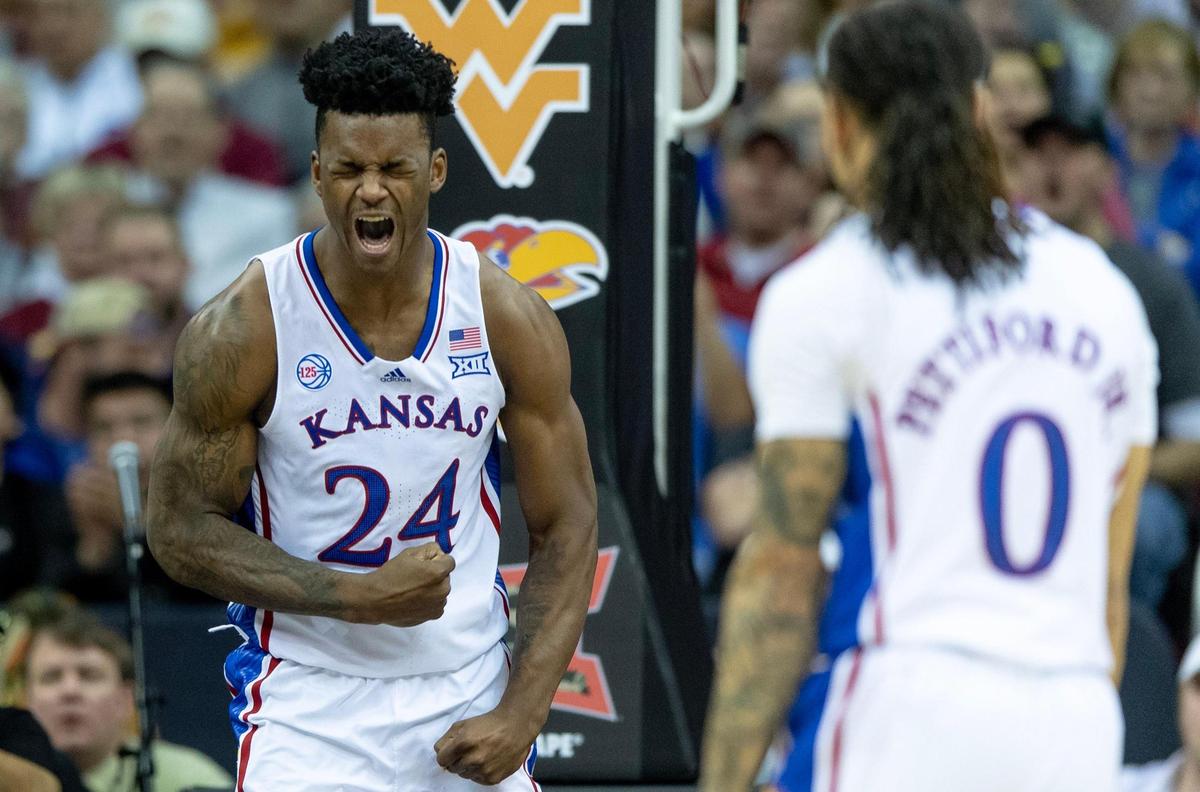 Kansas forward K.J. Adams Jr. (24) celebrates a dunk against West Virginia during an NCAA college basketball game in the second round of the Big 12 Conference tournament Thursday, March 9, 2023, in Kansas City.
