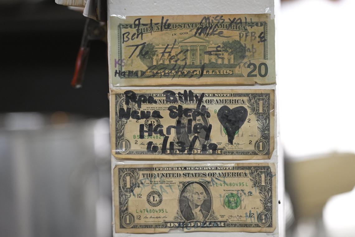 Dollar bills from customers hang in the kitchen at Guy & Mae’s Tavern. Before the pandemic hit, the tavern was covered in dollar bills, which were removed to help keep the business afloat during the COVID-19 crisis.