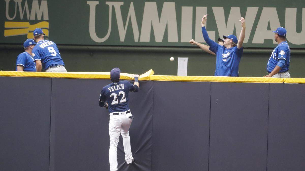 The Kansas City Royals' bullpen reacts as Milwaukee Brewers' Christian Yelich can't catch a home run hit by Mike Moustakas during the seventh inning of a baseball game Wednesday, June 27, 2018, in Milwaukee.