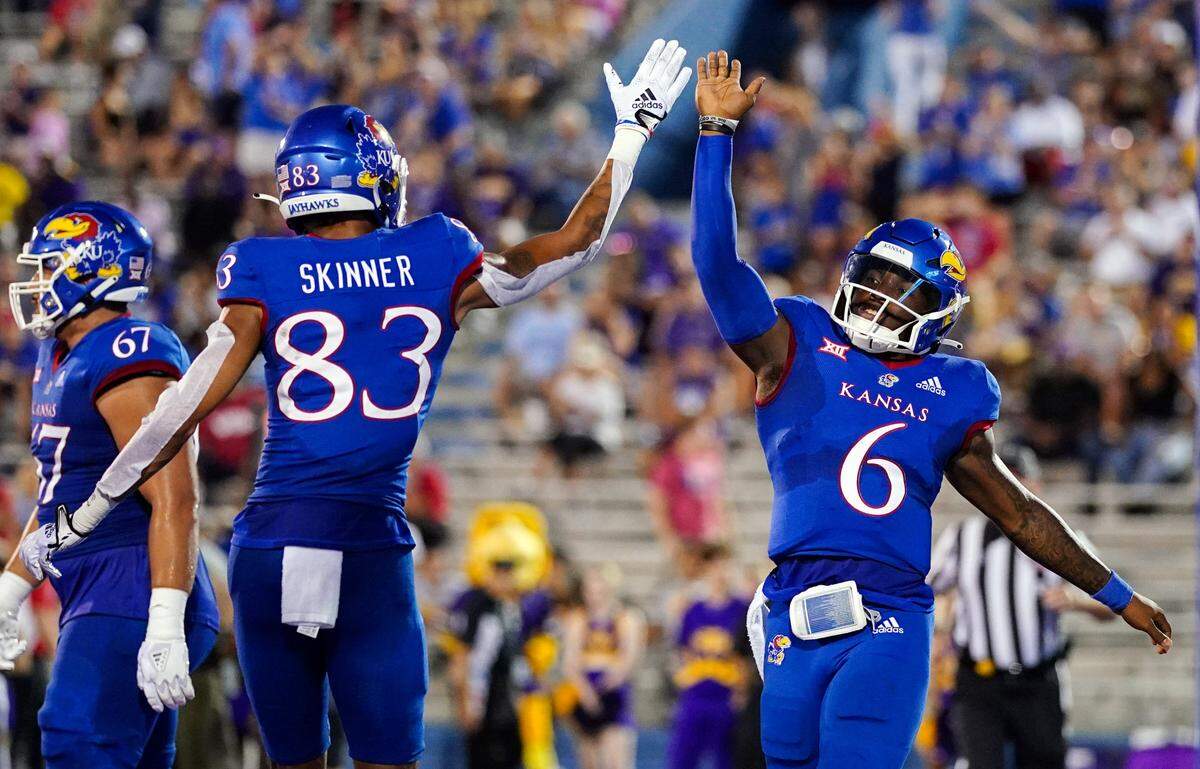 Kansas quarterback Jalon Daniels (6) celebrates with wide receiver Quentin Skinner (83) after scoring a touchdown against the Tennessee Tech Golden Eagles during the first half at David Booth Kansas Memorial Stadium on Sept. 2, 2022.