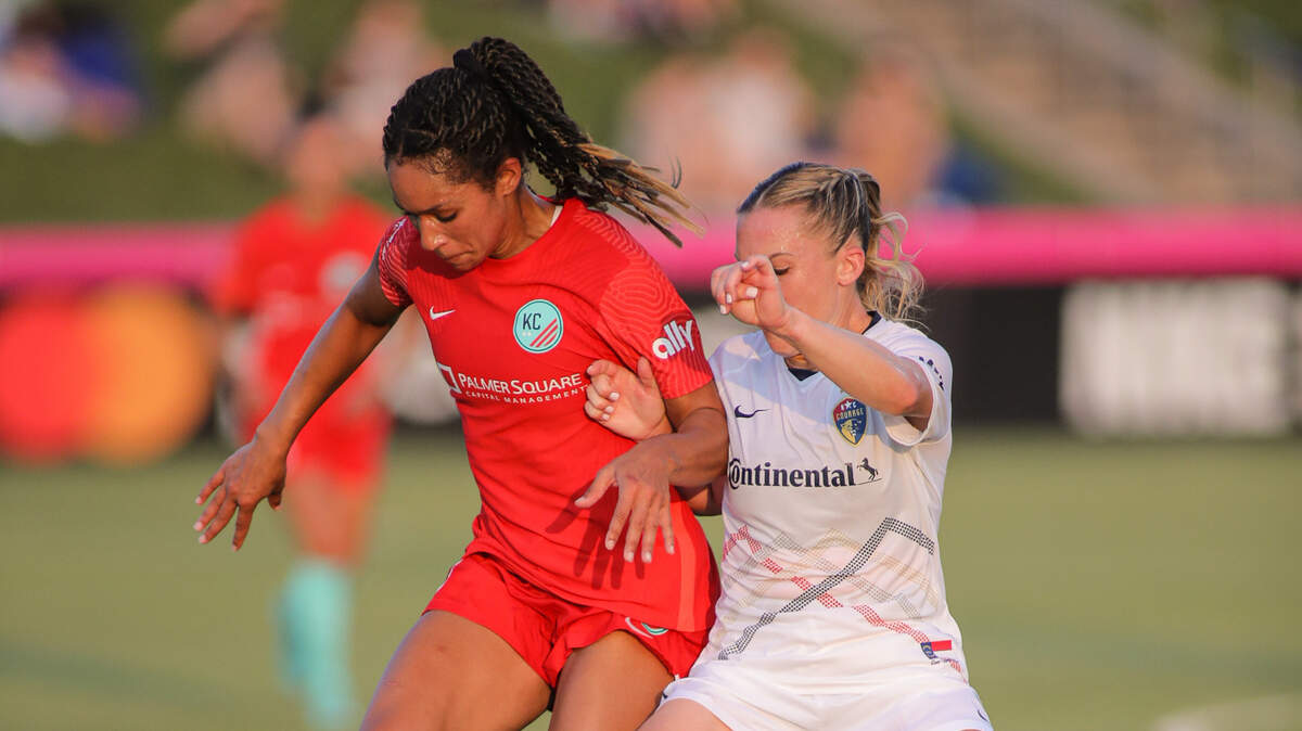 Kansas City National Women’s Soccer League forward Darian Jenkins attempts to fend off former KC NWSL captain Amy Rodriguez, now playing for the North Carolina Courage, in Friday night’s match at Legends Field.