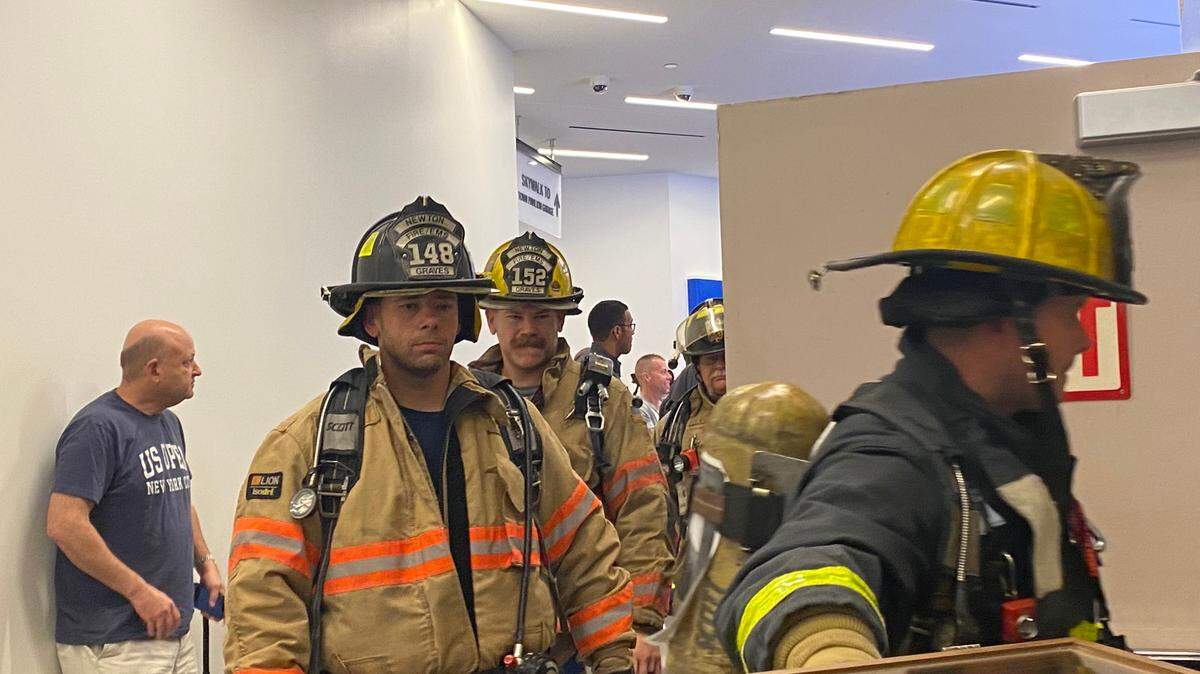 Firefighters from Kansas and Missouri get ready to climb up the stairwell of Town Pavilion in downtown Kansas City to honor the 343 firefighters who died at the twin towers on 9/11.