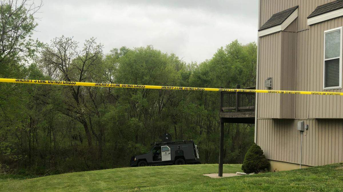 A homicide suspect cornered in the backyard of a Platte County home allegedly became emotional before officers from Kansas City and the Missouri State Highway Patrol fatally shot him Tuesday night. A police tactical vehicle remained in the backyard of one of the homes Wednesday morning. 