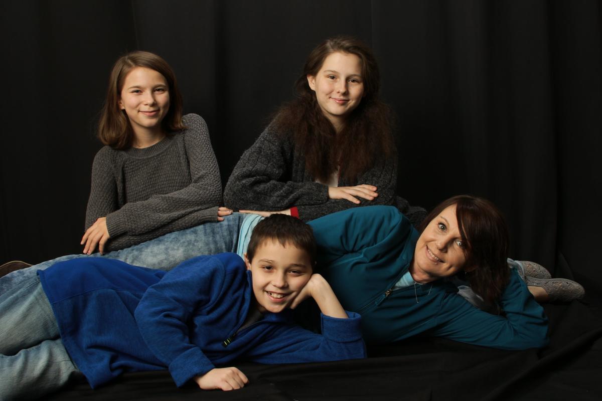 The new family: mom Micki Benson with, from left, Ashlyn, Christopher and Alyssa.