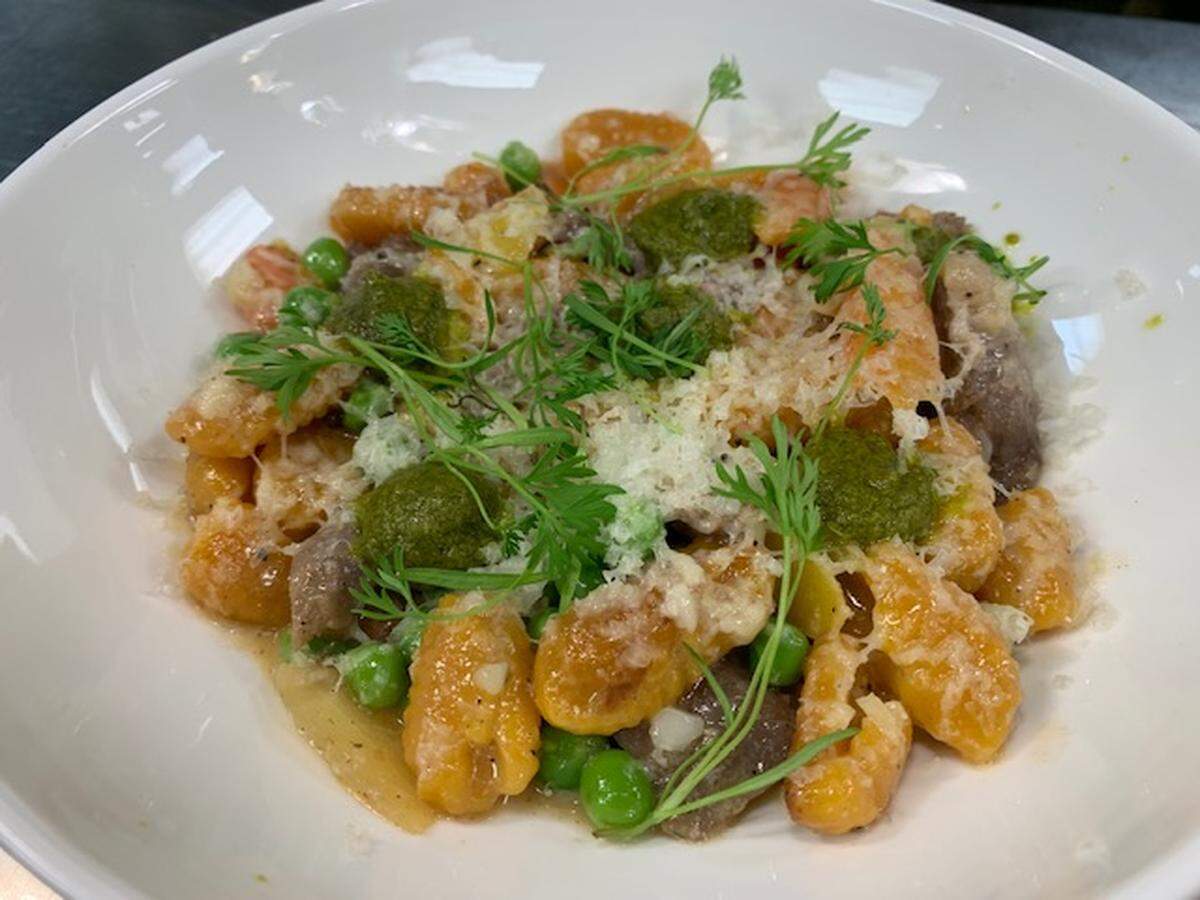 A spring menu item find: The carrot cavatelli, English peas, slow cooked baby carrots and carrot top pesto at Tavernonna in Hotel Phillips.