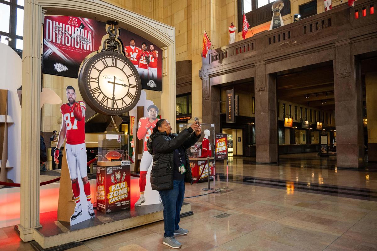Gwen Lee takes a selfie at the Chiefs Fan Zone at Union Station in Kansas City on Thursday, Jan. 16, 2025.