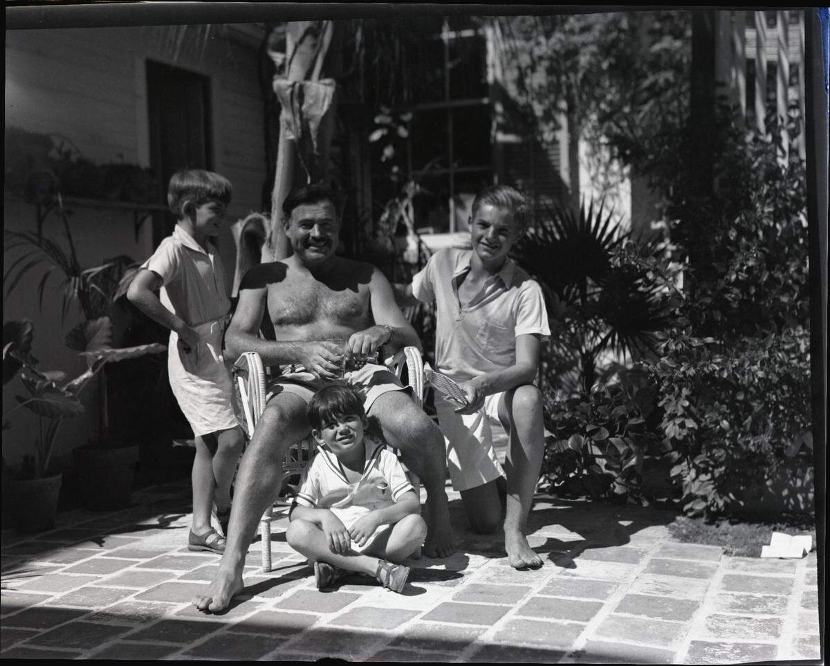 Ernest Hemingway with his three sons, Jack, Patrick and Gregory, at his Key West, Florida, home.