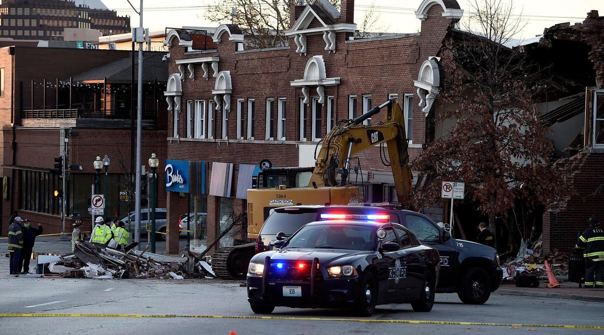 Two people were killed Wednesday night when a fire truck collided with an SUV and struck a building on Broadway Boulevard just north of Westport Road. Emergency crews were on the scene Thursday morning searching for a third victim who may have been in or near the building.