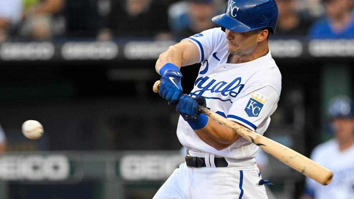 Kansas City Royals’ Andrew Benintendi hits a single against the Detroit Tigers during the first inning of a baseball game, Tuesday, July 12, 2022, in Kansas City, Mo. (AP Photo/Reed Hoffmann)