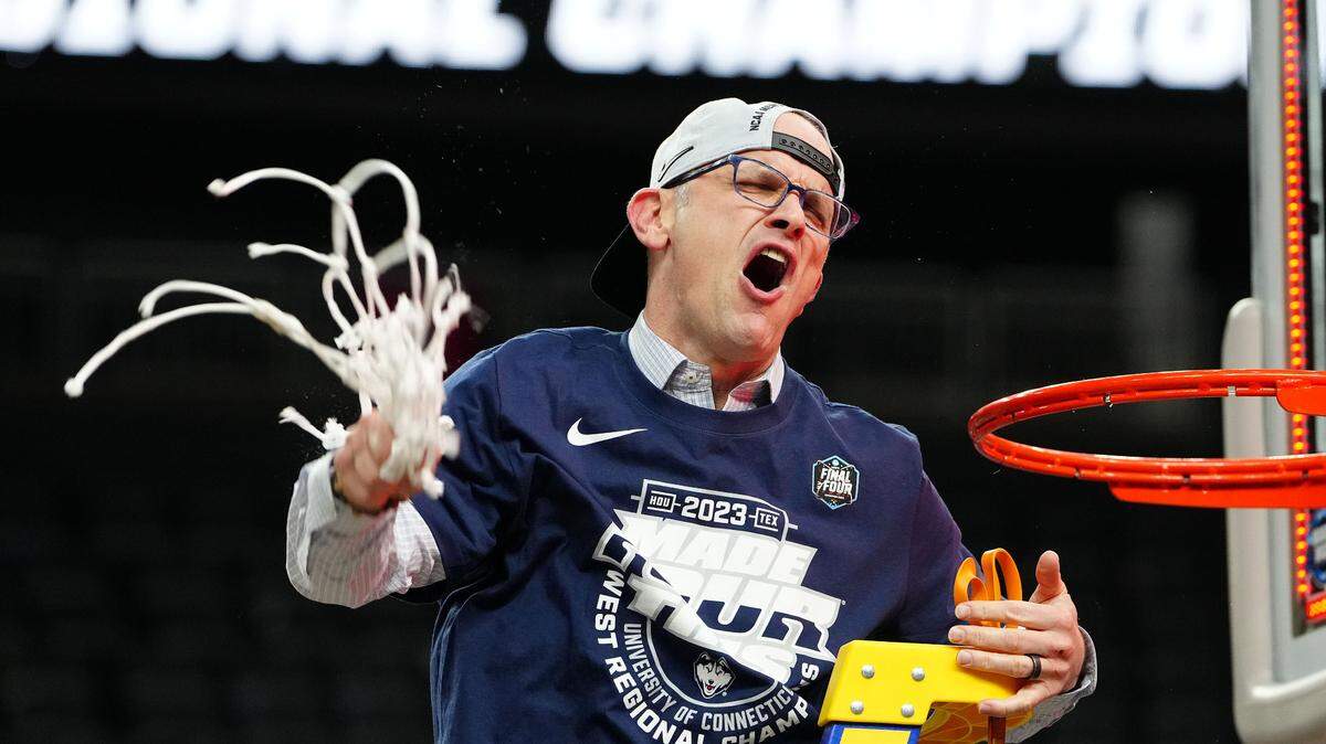 Connecticut Huskies head coach Dan Hurley cuts down the net following a victory against the Gonzaga Bulldogs in the NCAA Tournament West Regional final at T-Mobile Arena in Las Vegas on March 25, 2023.