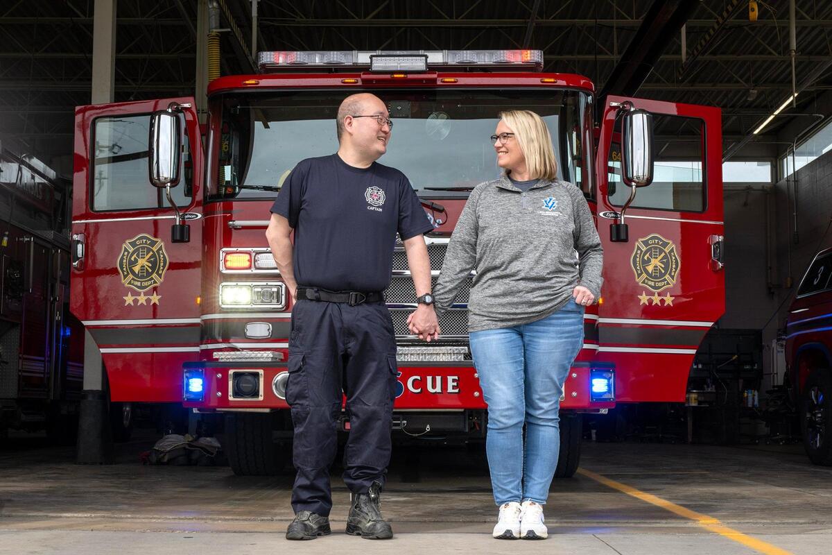 “Does this count as a wedding photo?” Capt. Karl Tsen of the Kansas City, Kansas Fire Department, smiled as he asked his wife, Kristy Tsen as they posed at Station 6 for a photo on Tuesday, March 18, 2025, while reflecting on the Covid-19 pandemic.