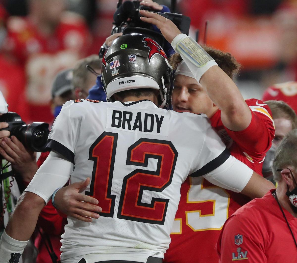 Tampa Bay Buccaneers quarterback Tom Brady and Kansas City Chiefs quarterback Patrick Mahomes meet up after the Buccaneers defeated the Chiefs 31-9 Sunday, February 7, 2021, at Super Bowl LV at Raymond James Stadium in Tampa, Florida.
