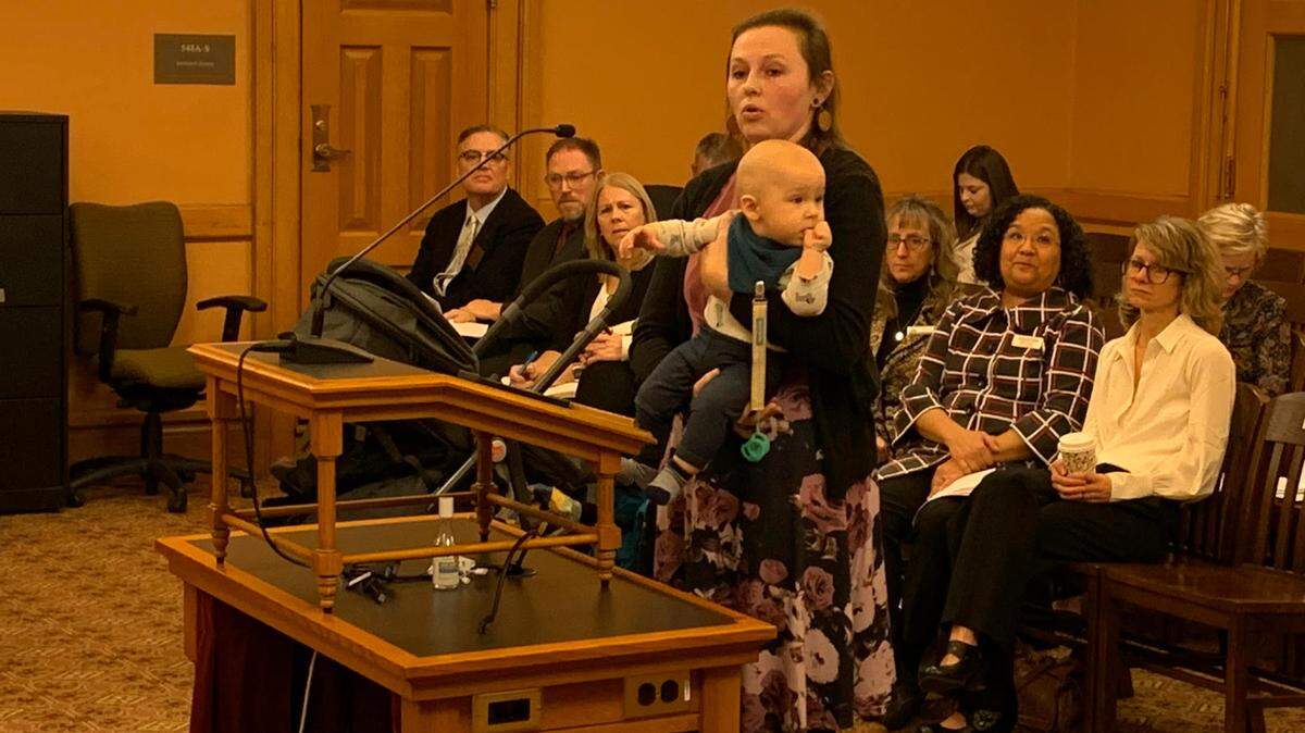 Korbe Bohac, holds her child Winston, as she urges Kansas lawmakers to approve a tax credit for crisis pregnancy centers. Bohac said she received services from INsight Women’s Center in Lawrence.