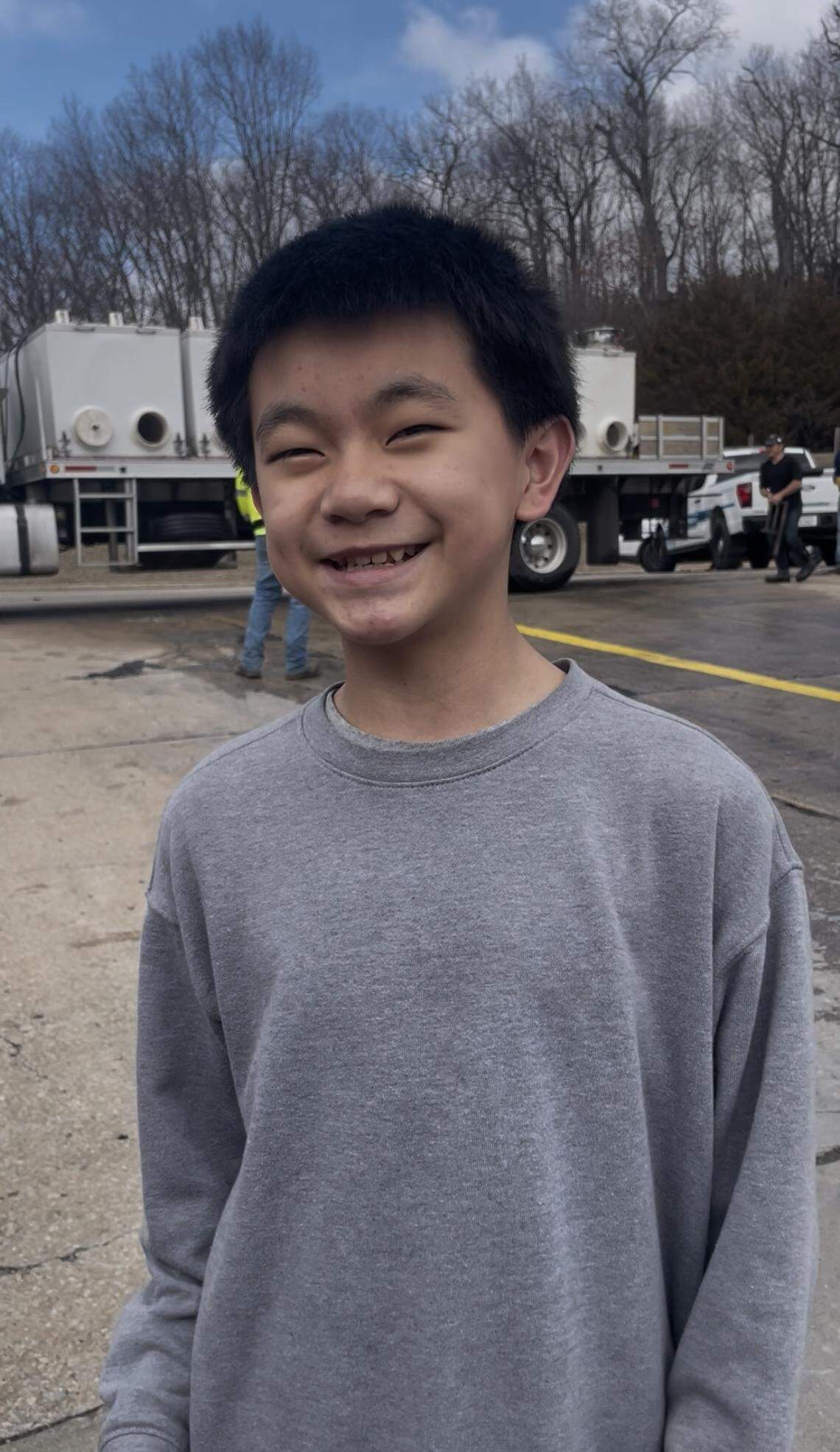Eljin Her, a freshman at F.L. Schlagle High School in Kansas City, Kansas, stands for a portrait at Wyandotte County Lake Park on March 3, 2026. Her was among several community members who came to watch parks department officials stock the lake with Rainbow trout ahead of the upcoming fishing season.