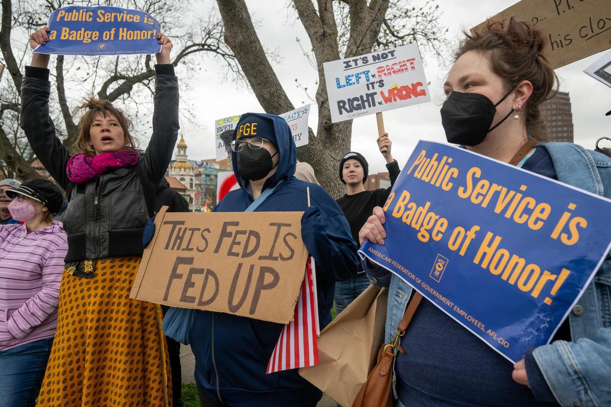 Protesters lined the street and expressed their views during Hands Off! Kansas City Fights Back on Saturday in Kansas City.