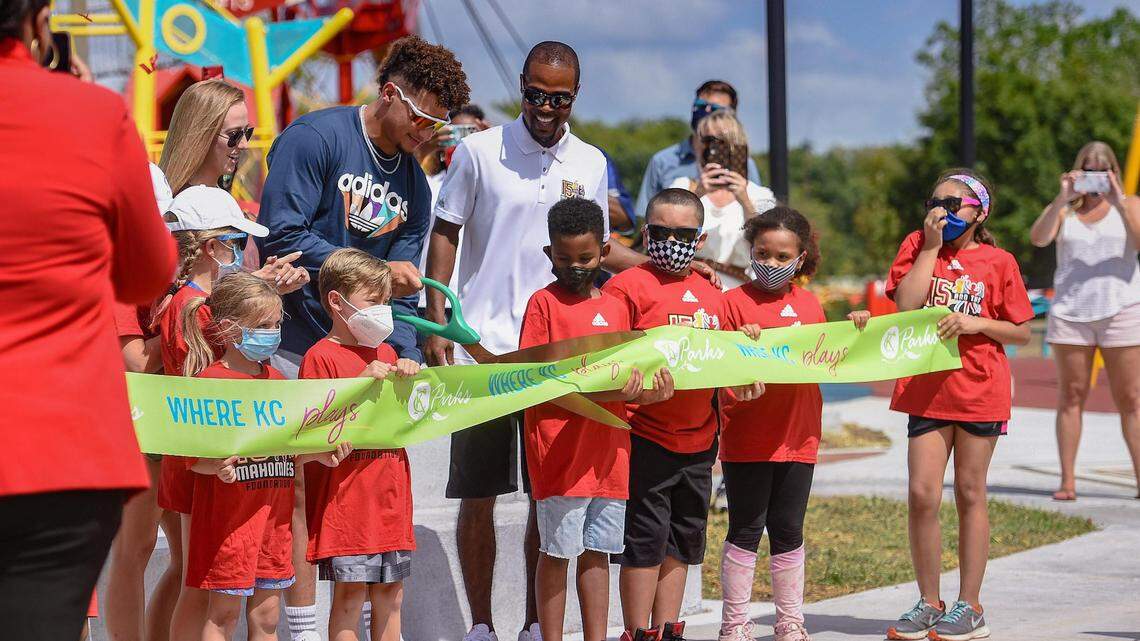Brittany Matthews, Patrick Mahomes and Marques Fitch of the 15 and the Mahomies Playground cut the ribbon at Martin Luther King, Jr. Park on Saturday, Aug. 28, 2021, at Dr. Martin Luther King, Jr. Blvd. & Woodland Ave., in Kansas City. Mahomes foundation, 15 and the Mahomies Foundation, donated $1 million to help transform the park making it accessible for children of all abilities.