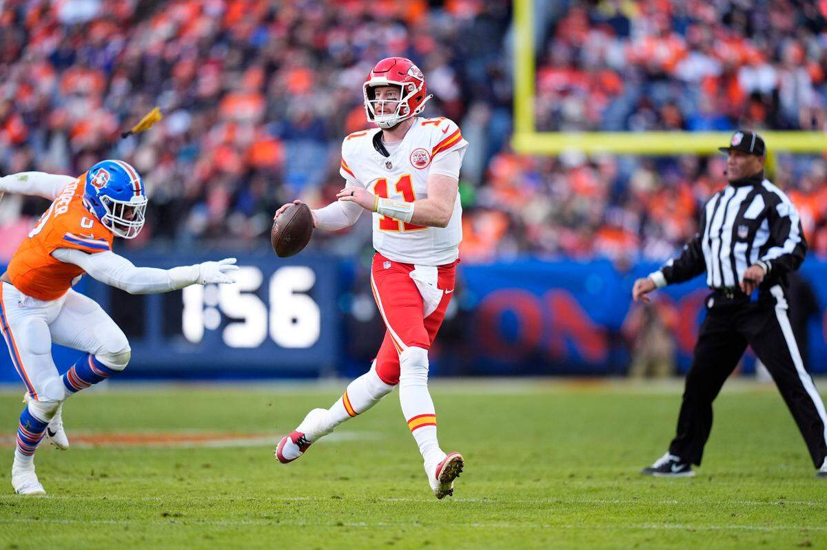 Kansas City Chiefs quarterback Carson Wentz (No. 11) looks to pass against the Broncos during the teams’ NFL Week 18 game at Empower Field at Mile High in Denver on Sunday, Jan. 5, 2025.