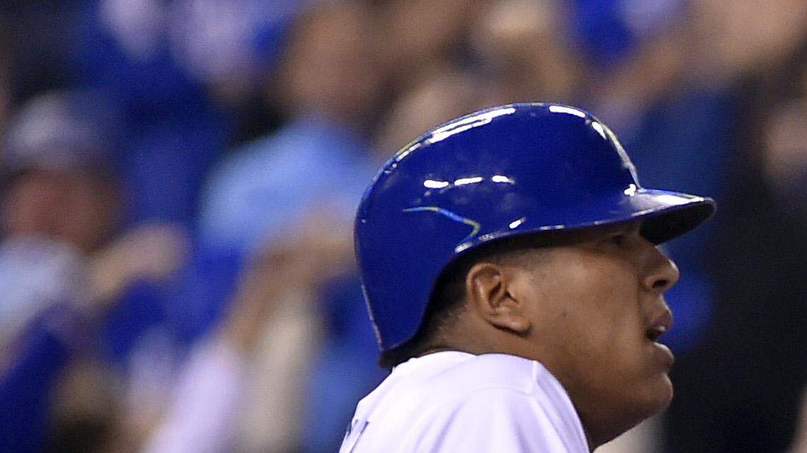 Kansas City Royals catcher Salvador Perez was confused by home plate umpire Eric Cooper's warning to him while Kansas City Royals second baseman Omar Infante came in on a home run he hit in the sixth inning that drove in Perez in game two of the World Series on Wednesday, October 22, 2014, at Kauffman Stadium in Kansas City, Mo. Cooper had advised Perez to let Infante make it to base before coming out to greet him any closer.