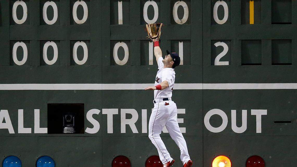 Boston Red Sox’s Andrew Benintendi makes the catch on a fly-out by Los Angeles Angels’ David Fletcher during the eighth inning of a baseball game in Boston, Thursday, June 28, 2018. (AP Photo/Michael Dwyer)