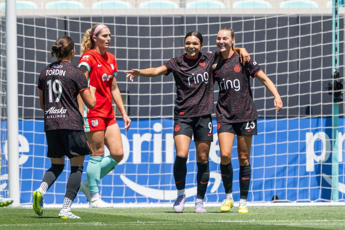 Portland Thorns FC forward Sophia Wilson (9) hugs Portland Thorns FC midfielder Marie Müller (23) after scoring a goal in the Current's match vs. Portland Thorns FC on Sunday, May 24, 2026, at CPKC Stadium.