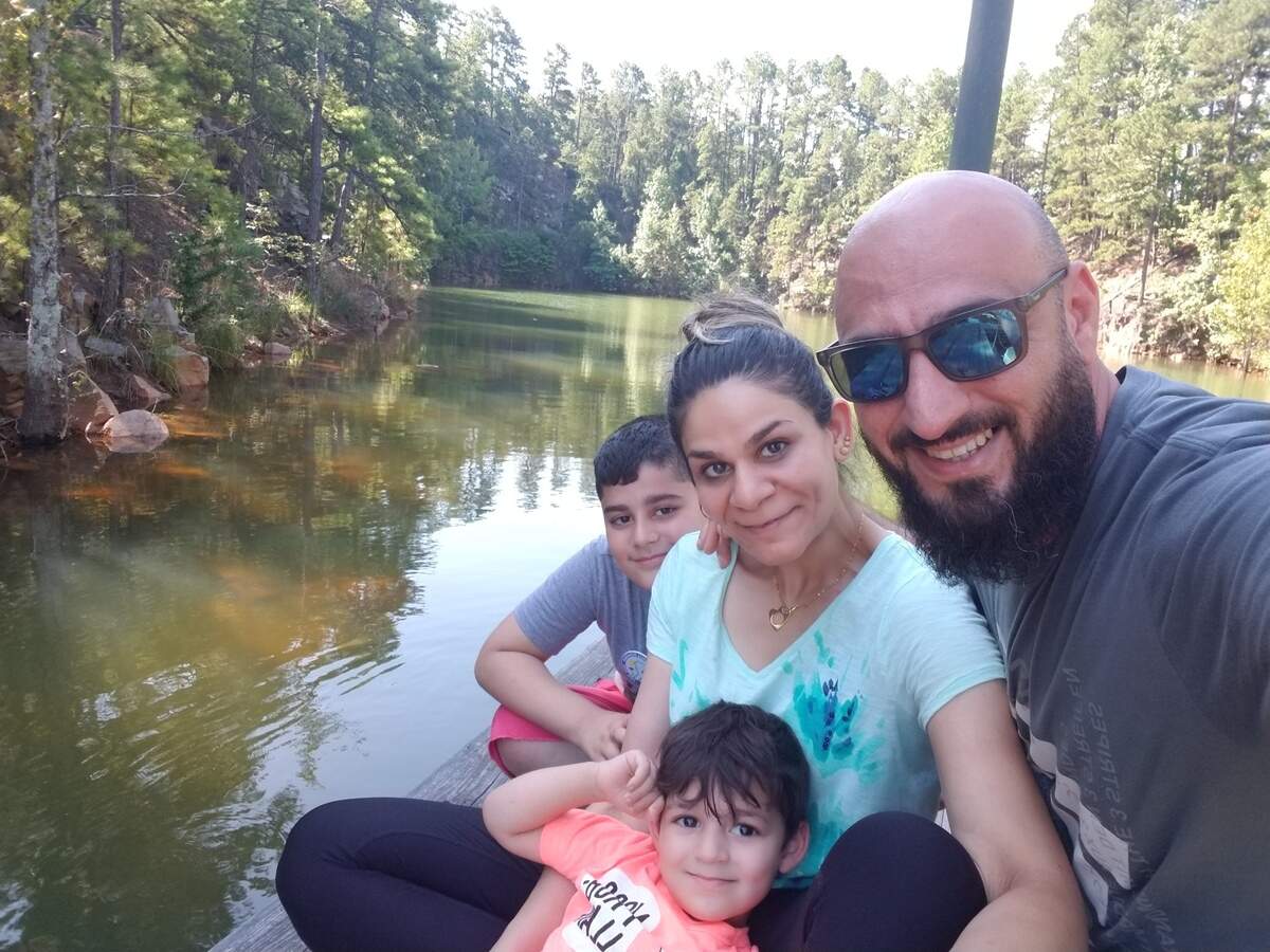 Noora Al Mafraji poses with her husband Saif and two children, Yazin and Nezar.