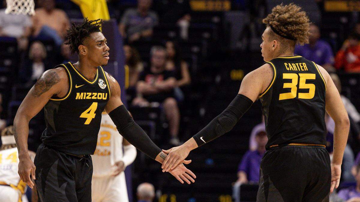 Missouri guard DeAndre Gholston (4) and forward Noah Carter (35) slap hands after a play against LSU at Pete Maravich Assembly Center on March 1, 2023.