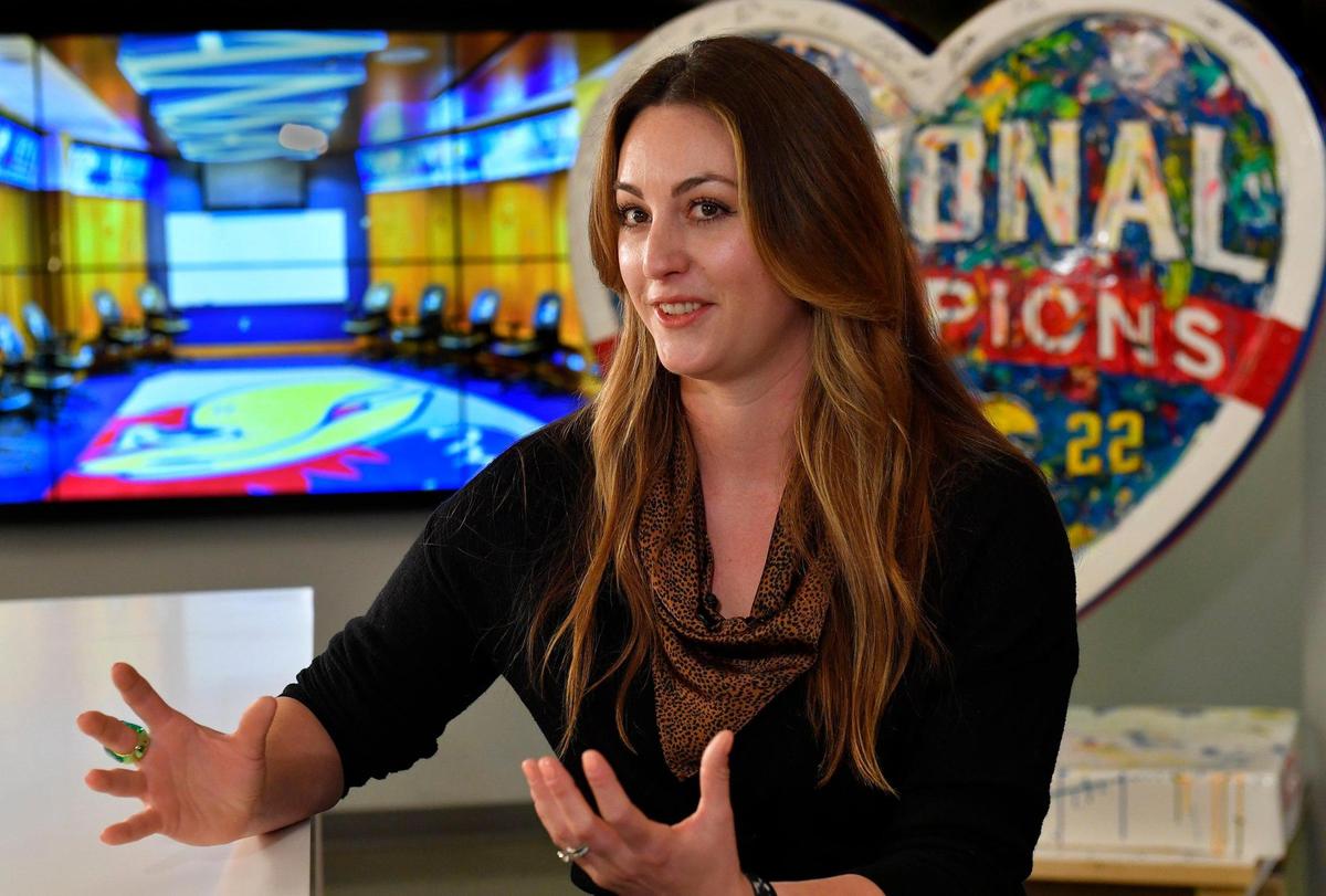 Artist Megh Knappenberger spoke Wednesday about creating “National Champions” her peice celebrating the KU Jayhawks basketball team’s recent NCAA championship victory. It took Knappenberger, a KU graduate, about two weeks to complete the peice, which is the 156th heart for the Parade of Hearts project. Kansas coach Bill Self and the 2022 team autographed it before It was unveiled Wednesday at Dimensional Innovations, in Overland Park.