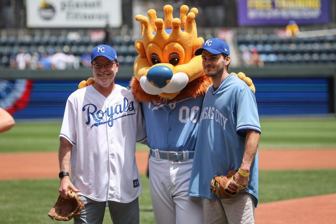 Actor Alex Neustaedter, right, and his dad, Jeff Neustaedter, got their photo taken with Sluggerrr after Alex threw out the first pitch at Kuffman Stadium on June 26.