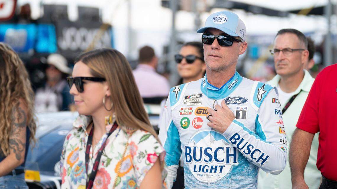 Kevin Harvick walks down pit row before the NASCAR Southern 500 auto race Sunday, Sept. 4, 2022, in Darlington, S.C. Eric Jones won the race after taking the lead from Kyle Busch when Busch blew a motor with 30 laps remaining in the race. (AP Photo/Sean Rayford)