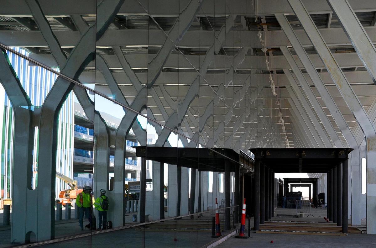 Work continues on Thursday on the new Kansas City International Airport terminal. The curtain wall, or glass panels, have been installed in the front of the terminal.