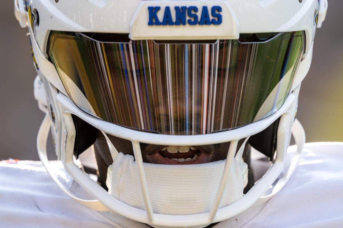 Kansas Jayhawks quarterback Jalon Daniels (6) warms up on the sideline during a timeout in the fourth quarter of a game against the Missouri Tigers at Faurot Field at Memorial Stadium on Saturday, Sept. 6, 2025, in Columbia. KU lost the rendition of the Border War. 